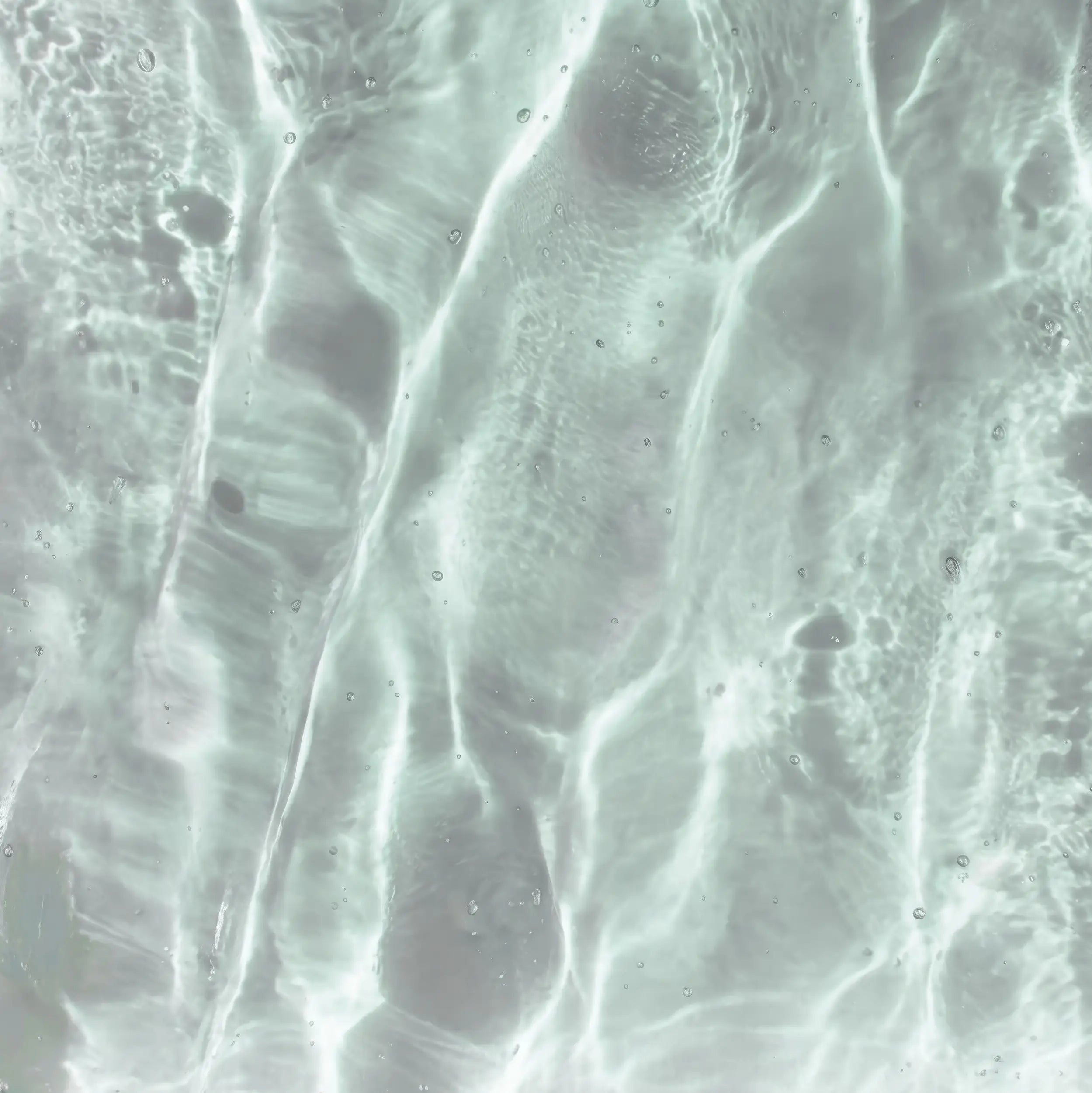 Close-up of a textured GLASSVERDE glass surface with wavy patterns
